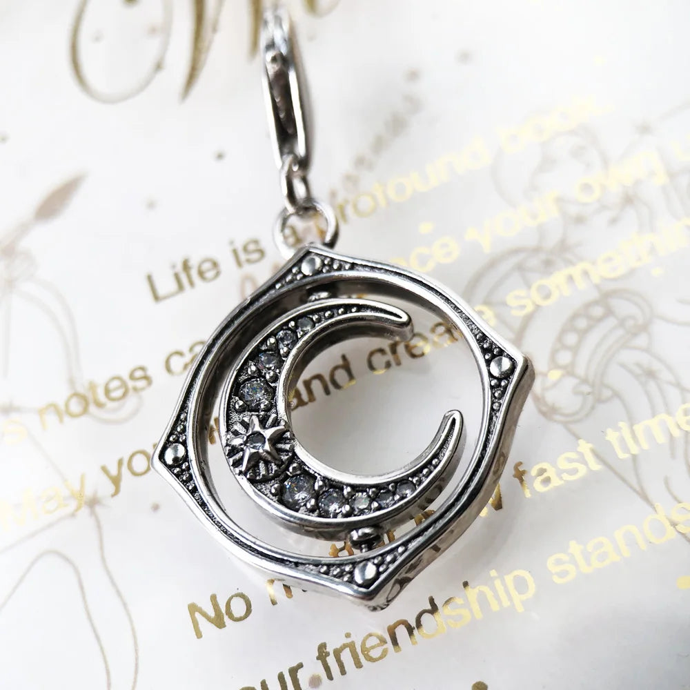 Spinning Moon Charm